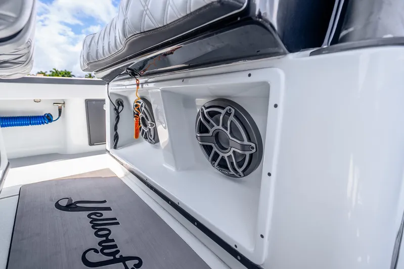  Yacht Photos Pics 2024 Yellowfin 39 Offshore boat interior with speakers and seating detail.