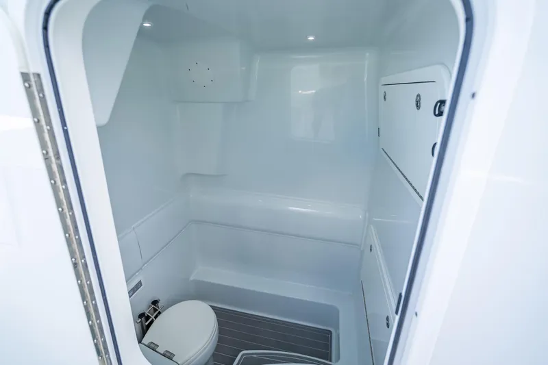  Yacht Photos Pics 2024 Yellowfin 39 Offshore boat interior bathroom with modern fixtures and white finish.