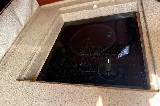 Andiamo Yacht Photos Pics 2006 Chris Craft Corsair Heritage boat stove with sleek black cooktop.