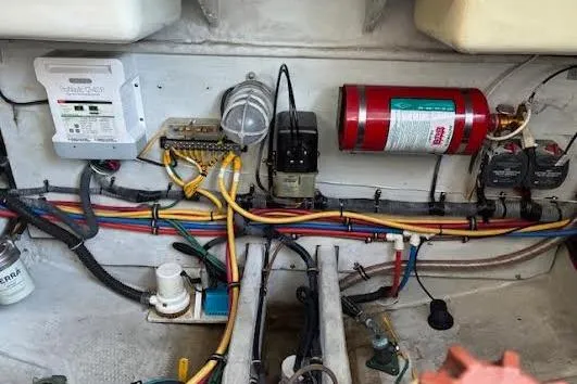 Andiamo Yacht Photos Pics Engine compartment of a 2006 Chris Craft Corsair Heritage with wiring and fire extinguisher.