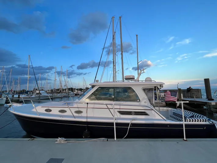  Yacht Photos Pics 2013 Back Cove 34 yacht docked at marina during sunset.