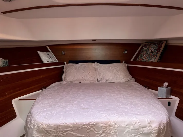  Yacht Photos Pics Cozy cabin interior of 2013 Back Cove 34 with a neatly made bed.