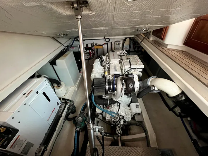  Yacht Photos Pics Engine room of 2013 Back Cove 34 boat, showcasing machinery and components.