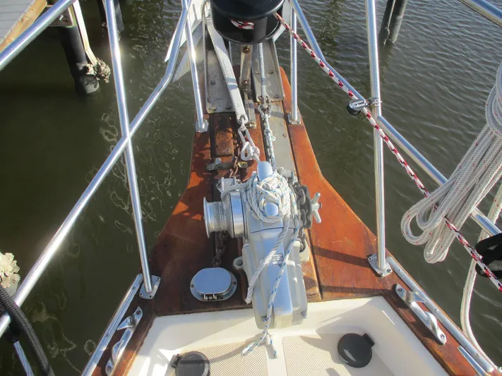  Yacht Photos Pics Bow of 1999 Island Packet 380 sailboat with anchor and winch system.