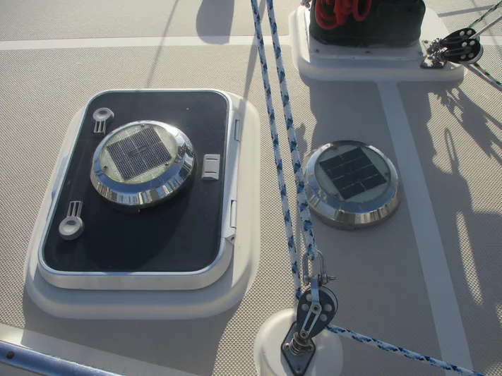  Yacht Photos Pics Deck of 1999 Island Packet 380 sailboat with solar vents and rigging.