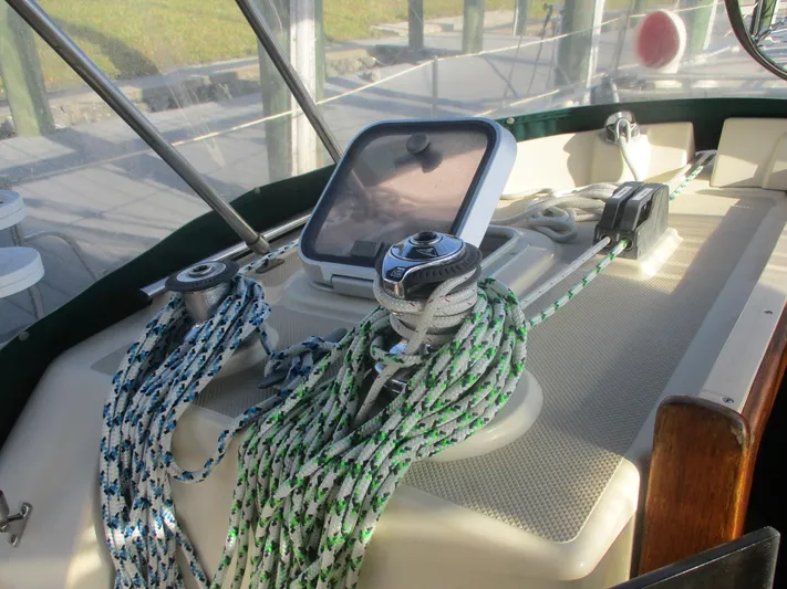  Yacht Photos Pics Cockpit of 1999 Island Packet 380 sailboat with ropes and navigation equipment.