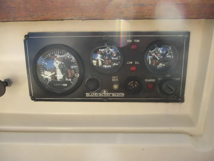  Yacht Photos Pics Control panel of a 1999 Island Packet 380 sailboat with gauges and indicators.