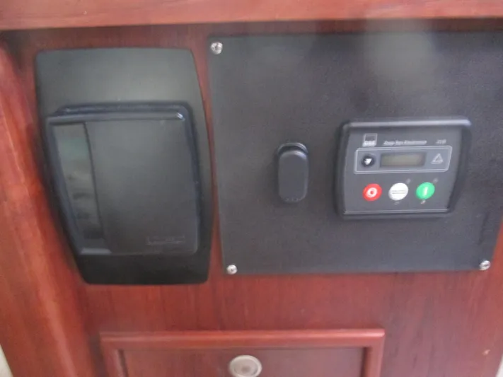  Yacht Photos Pics Control panel on 1999 Island Packet 380 sailboat interior, featuring switches and indicators.