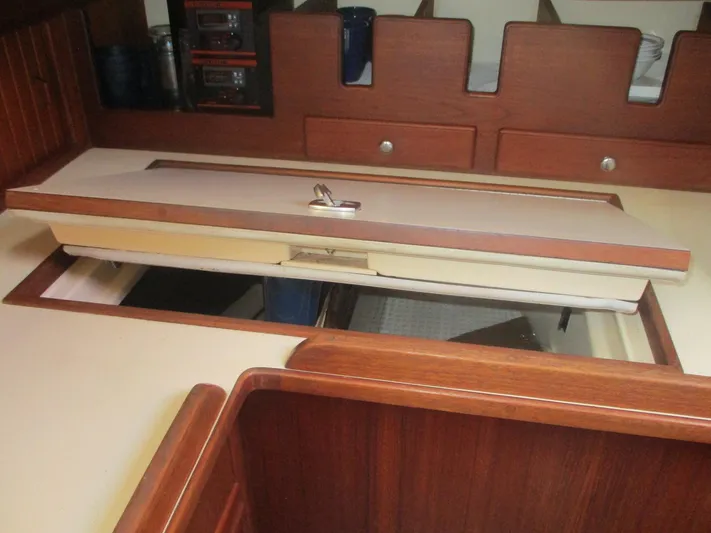  Yacht Photos Pics Interior of 1999 Island Packet 380 sailboat showing wooden cabinetry and storage compartments.