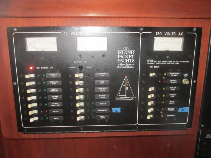  Yacht Photos Pics Electrical control panel of a 1999 Island Packet 380 yacht, featuring voltage meters and switches.