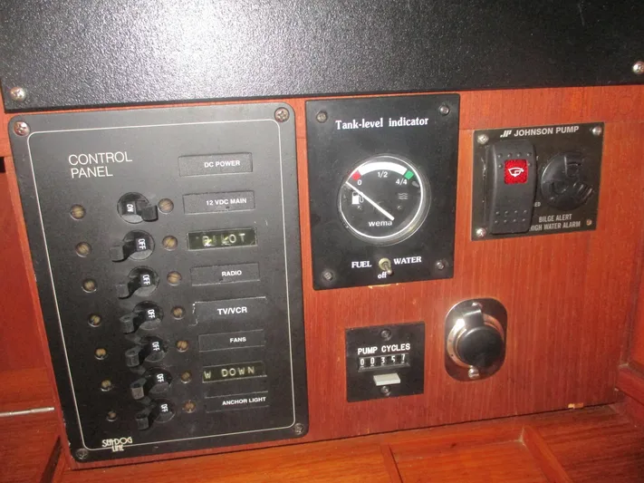  Yacht Photos Pics Control panel of a 1999 Island Packet 380 sailboat with tank-level indicator and pump controls.