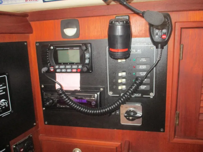  Yacht Photos Pics Control panel of a 1999 Island Packet 380 sailboat with radio and switches.