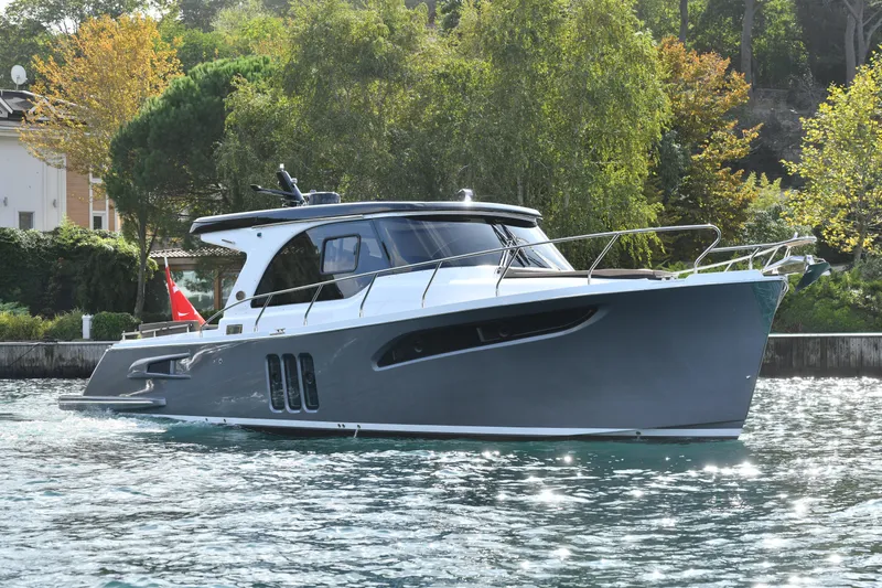 Falcon F-42 2x440 Hp Yanmar Yacht Photos Pics 2025 Falcon Yachts F-42 cruising on water, featuring sleek design and modern amenities.