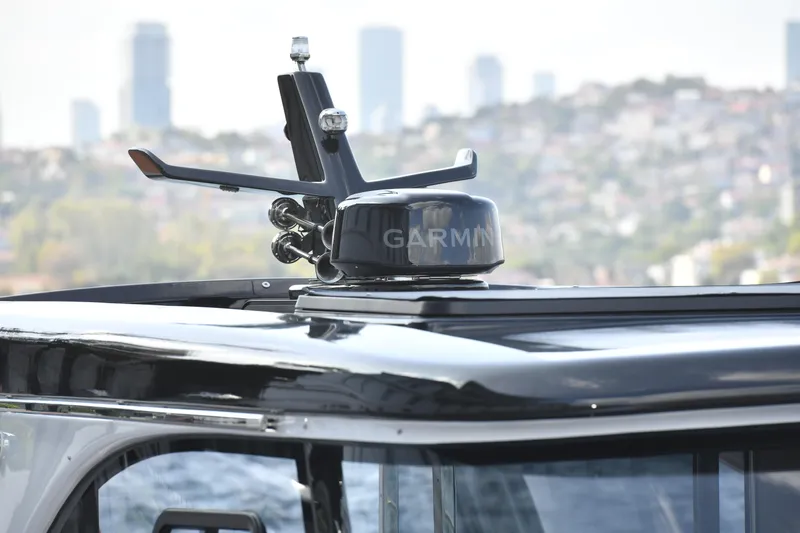 Falcon F-42 2x440 Hp Yanmar Yacht Photos Pics Rooftop of 2025 Falcon Yachts F-42 with Garmin equipment against city skyline.