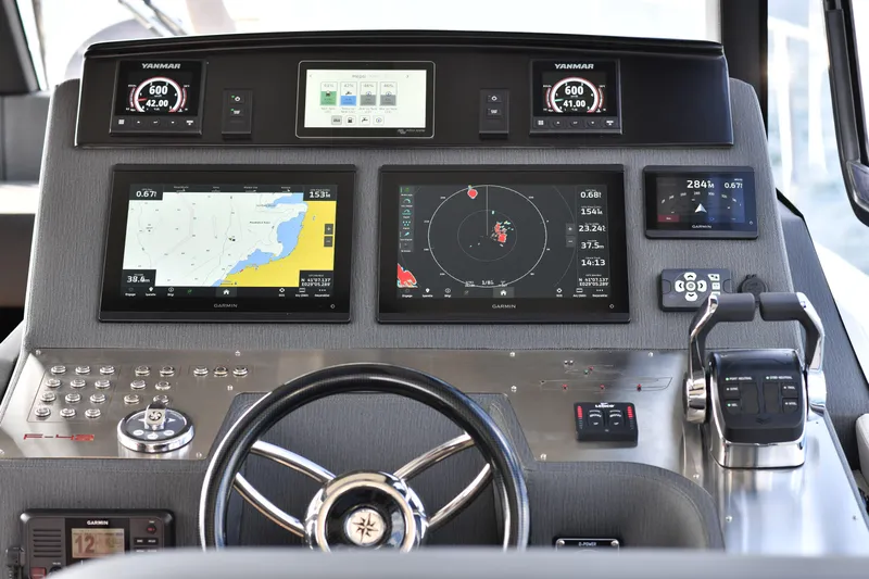 Falcon F-42 2x440 Hp Yanmar Yacht Photos Pics Cockpit of 2025 Falcon Yachts F-42 with advanced navigation displays and joystick controls.