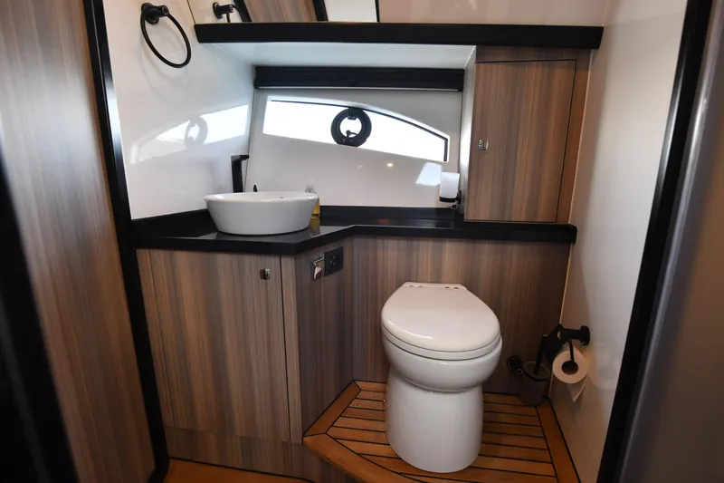 Falcon F-42 2x440 Hp Yanmar Yacht Photos Pics Luxurious bathroom in 2025 Falcon Yachts F-42, featuring modern fixtures and wood accents.