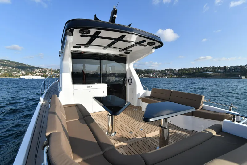 Falcon F-42 2x440 Hp Yanmar Yacht Photos Pics Luxurious 2025 Falcon Yachts F-42 with spacious deck, modern seating, and scenic water view.