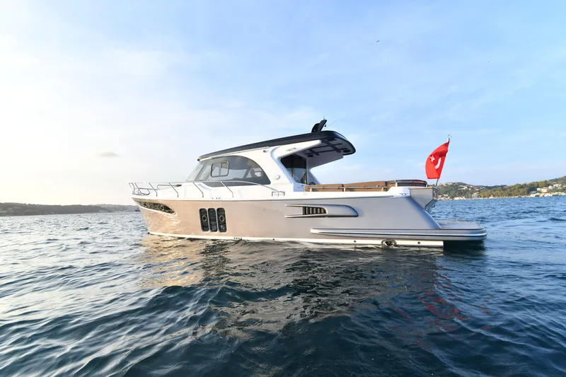 Falcon F-42 2x440 Hp Yanmar Yacht Photos Pics 2025 Falcon Yachts F-42 on water, featuring sleek design and joystick control.