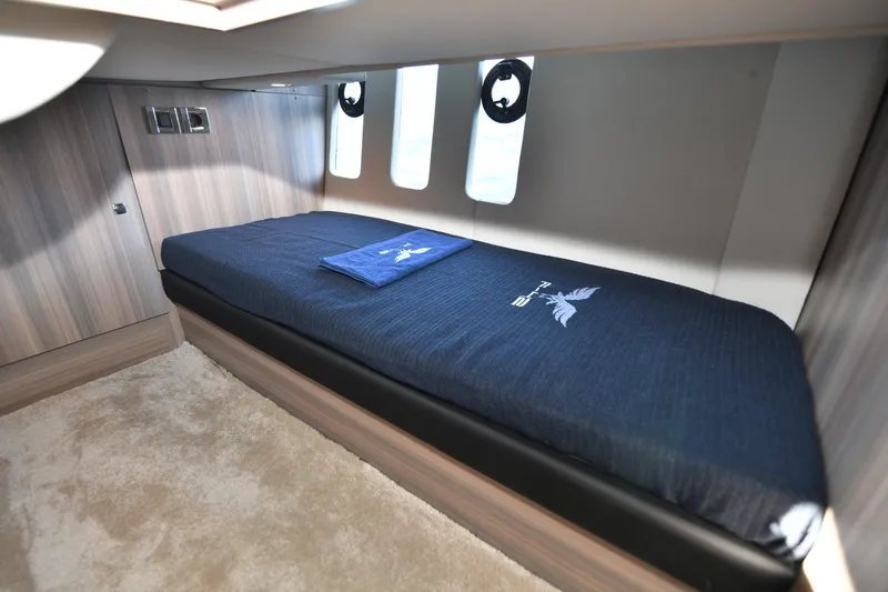 Falcon F-42 2x440 Hp Yanmar Yacht Photos Pics Cabin interior of 2025 Falcon Yachts F-42, featuring a single bed and modern design.