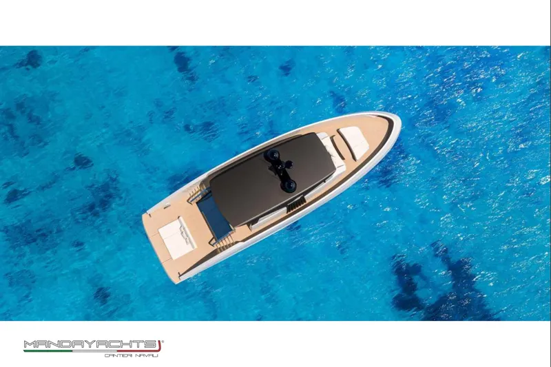  Yacht Photos Pics Aerial view of 2025 MandaYachts S06 on vibrant blue ocean waters.