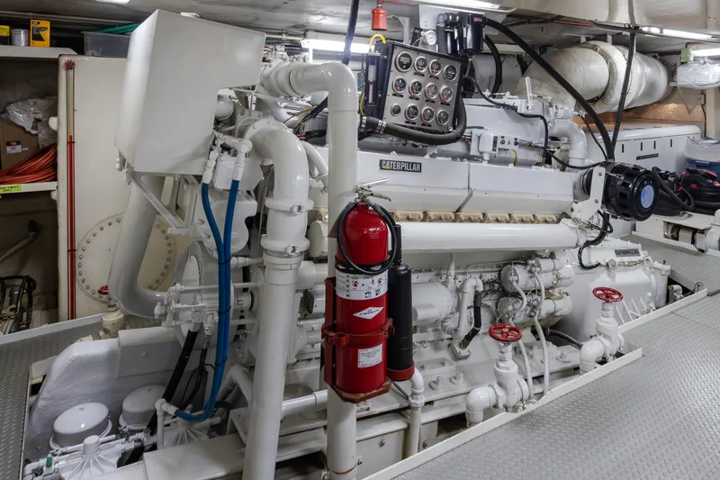  Yacht Photos Pics Engine room of a 1974 Willard 1201 with Caterpillar machinery and fire extinguisher.