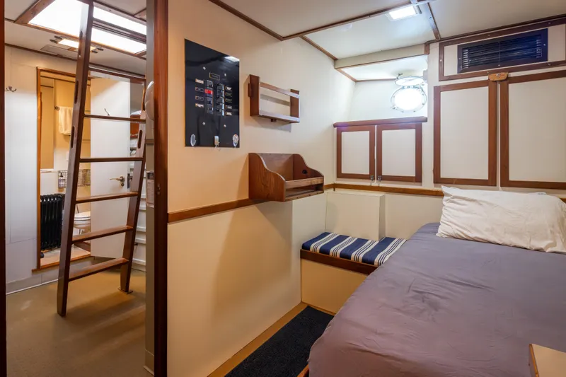  Yacht Photos Pics 1974 Willard 1201 boat interior with bed, ladder, and bathroom.