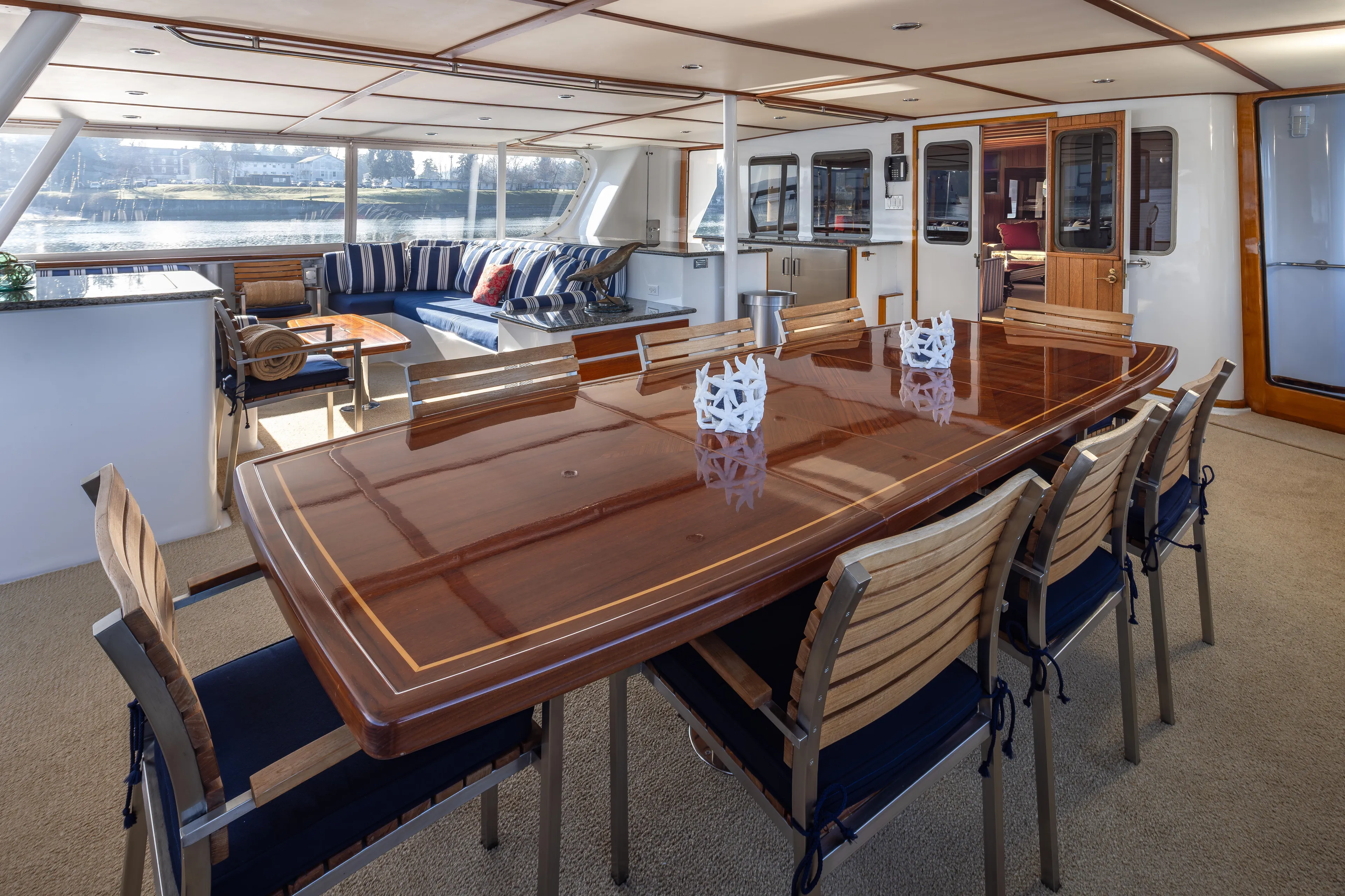  Yacht Photos Pics Luxurious interior of 1974 Willard 1201 yacht with elegant dining area and scenic views.