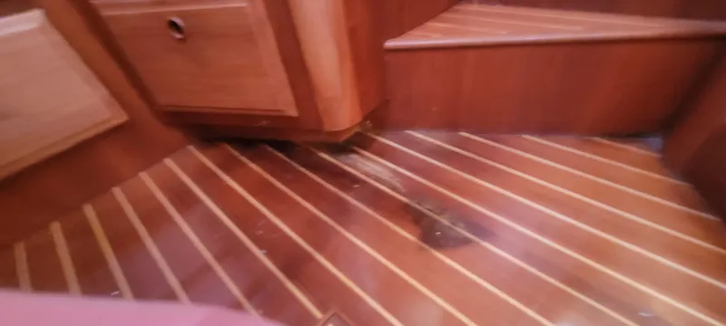 Midnight Yacht Photos Pics Wooden interior flooring of 2001 Sabreline 43 Flybridge Motoryacht with Cockpit.