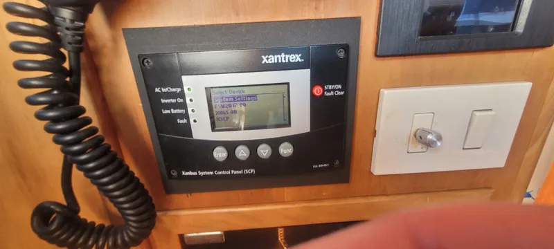 Midnight Yacht Photos Pics Control panel on 2001 Sabreline 43 Flybridge Motoryacht, featuring Xantrex system settings.