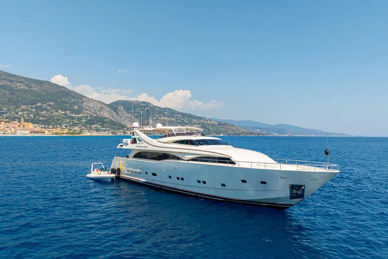 Champagne And Caviar Yacht Photos Pics Luxurious 2003 Ferretti Yachts Custom Line 112 cruising on serene blue waters.