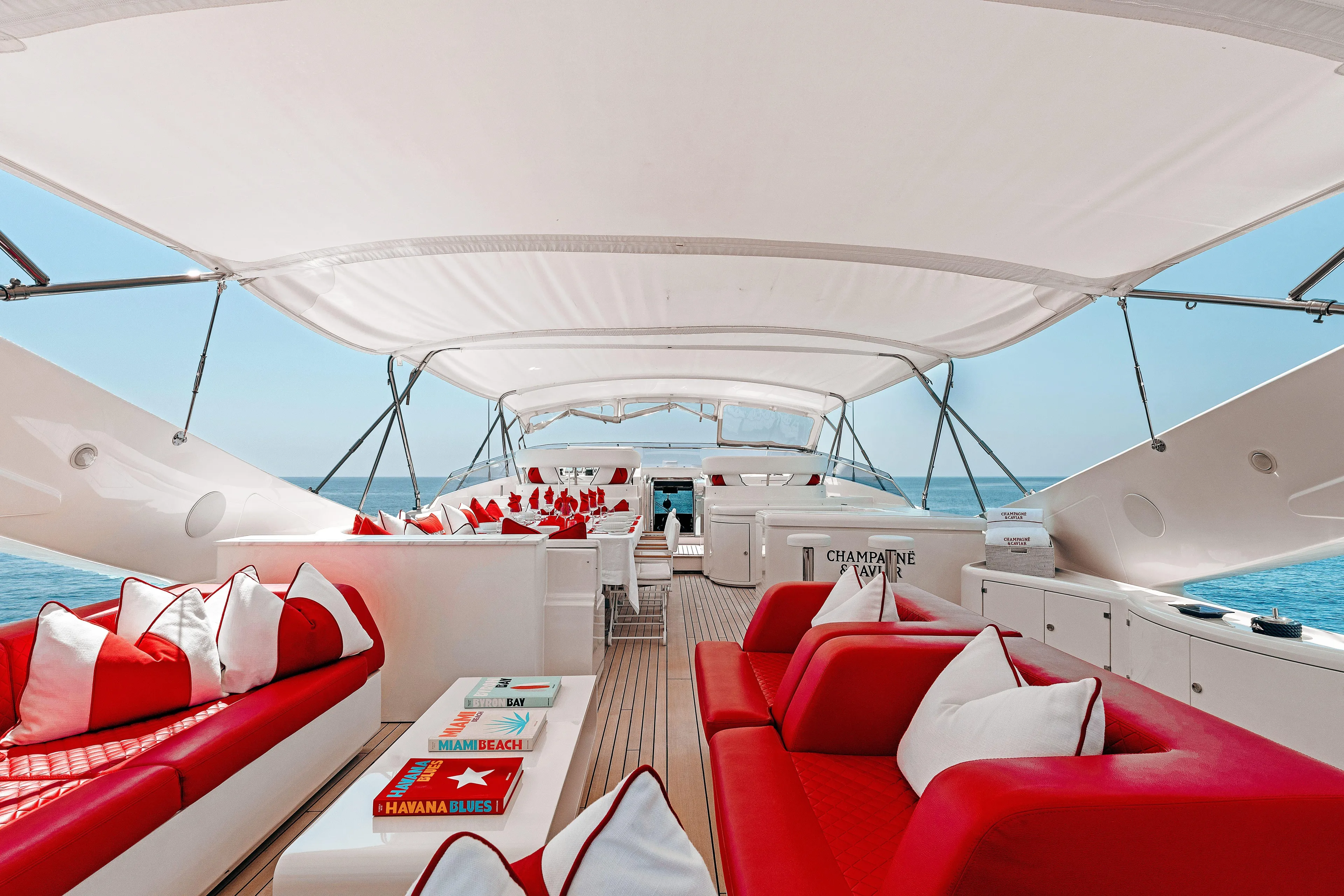 Champagne And Caviar Yacht Photos Pics Luxurious 2003 Ferretti Yachts Custom Line 112 with elegant red and white seating on deck.