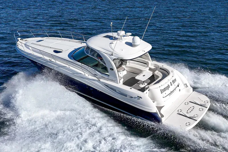 Enough 4 Now! Yacht Photos Pics 2005 Sea Ray 500 Sundancer cruising on open water, showcasing sleek design and powerful performance.