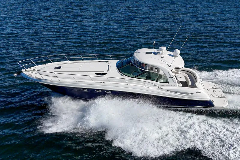 Enough 4 Now! Yacht Photos Pics 2005 Sea Ray 500 Sundancer cruising on open water, showcasing sleek design and powerful performance.