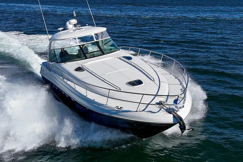 Enough 4 Now! Yacht Photos Pics 2005 Sea Ray 500 Sundancer cruising on open water, showcasing sleek design and powerful performance.