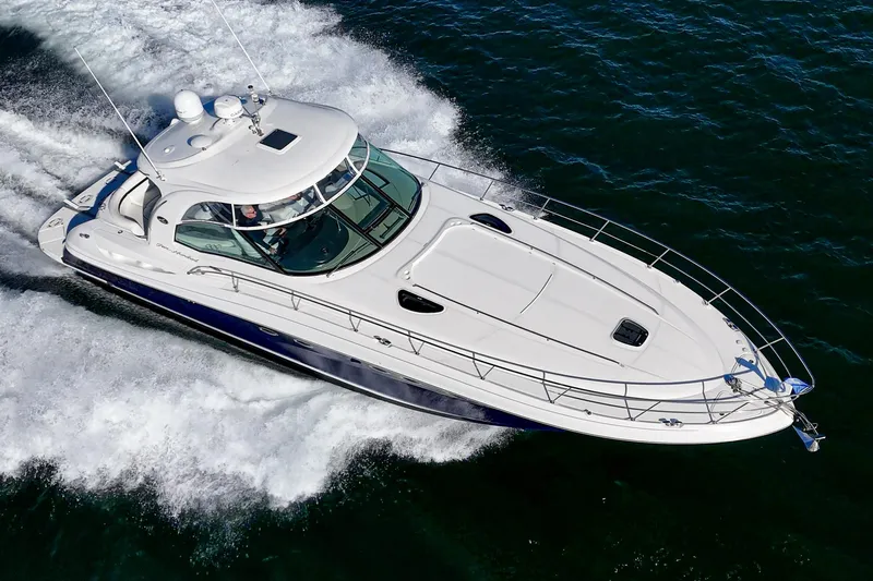 Enough 4 Now! Yacht Photos Pics 2005 Sea Ray 500 Sundancer yacht cruising on open water.