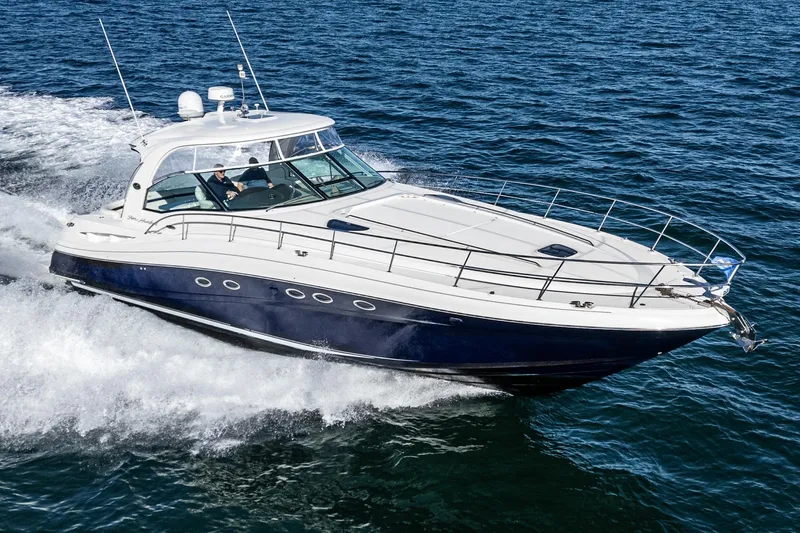 Enough 4 Now! Yacht Photos Pics 2005 Sea Ray 500 Sundancer yacht cruising on open water.