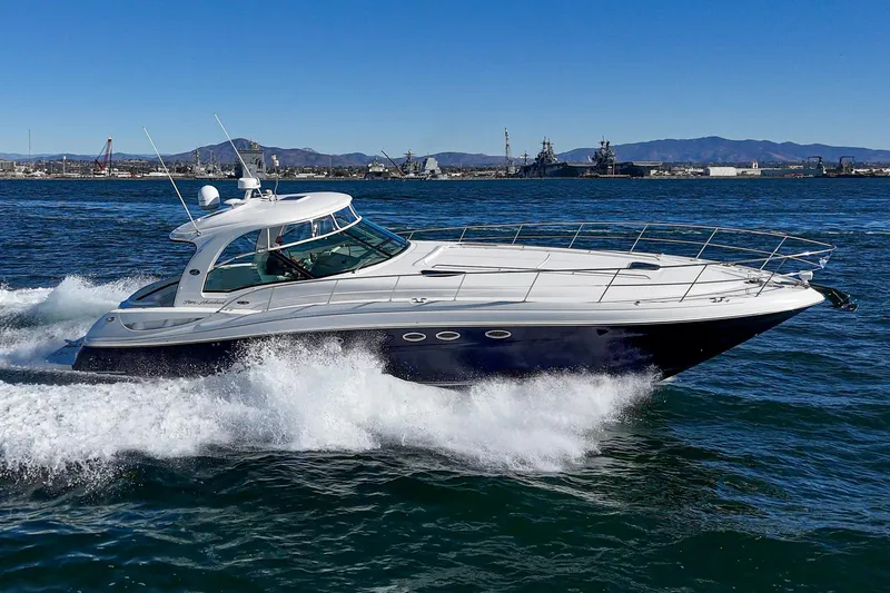 Enough 4 Now! Yacht Photos Pics 2005 Sea Ray 500 Sundancer yacht cruising on open water.