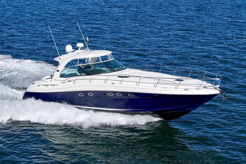 Enough 4 Now! Yacht Photos Pics 2005 Sea Ray 500 Sundancer yacht cruising on open water.