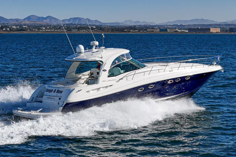 Enough 4 Now! Yacht Photos Pics 2005 Sea Ray 500 Sundancer yacht cruising on open water.