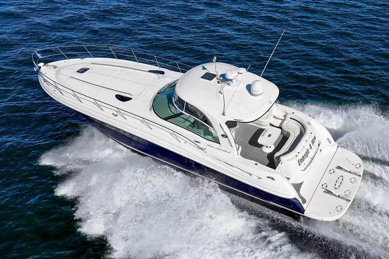 Enough 4 Now! Yacht Photos Pics 2005 Sea Ray 500 Sundancer yacht cruising on open water, aerial view.