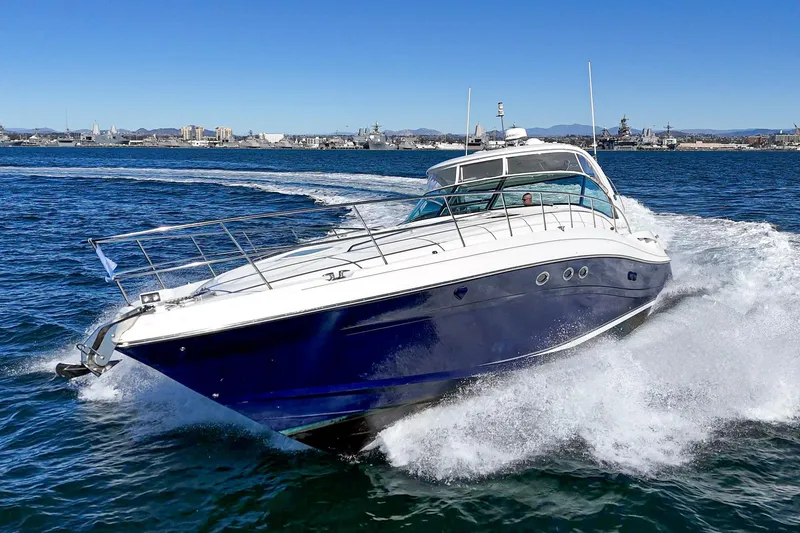 Enough 4 Now! Yacht Photos Pics 2005 Sea Ray 500 Sundancer yacht cruising on open water, creating a dynamic wake.