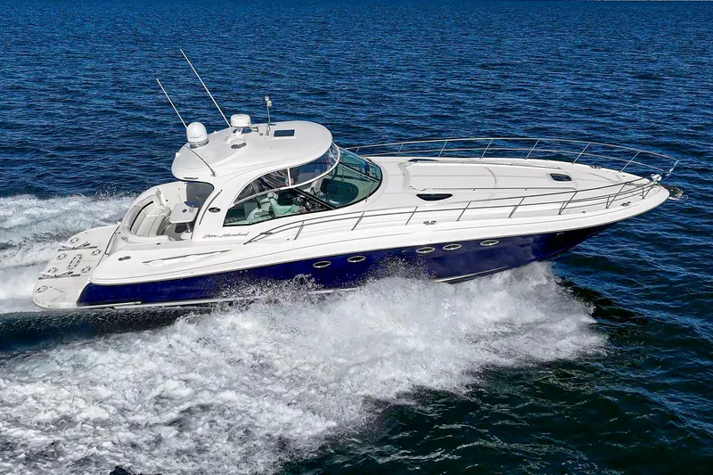Enough 4 Now! Yacht Photos Pics 2005 Sea Ray 500 Sundancer cruising on open water, showcasing sleek design and performance.