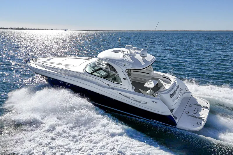 Enough 4 Now! Yacht Photos Pics 2005 Sea Ray 500 Sundancer cruising on open water under clear skies.