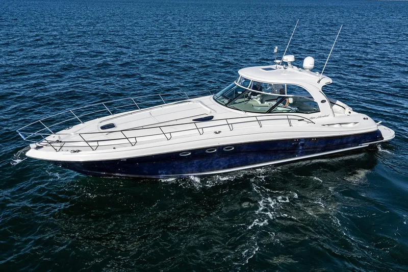 Enough 4 Now! Yacht Photos Pics 2005 Sea Ray 500 Sundancer yacht cruising on open water.