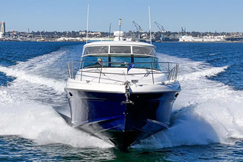 Enough 4 Now! Yacht Photos Pics 2005 Sea Ray 500 Sundancer yacht cruising on open water.