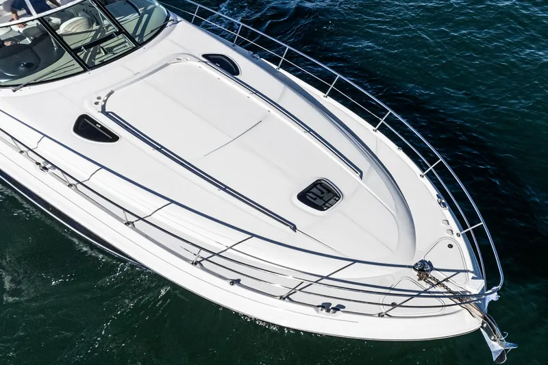 Enough 4 Now! Yacht Photos Pics 2005 Sea Ray 500 Sundancer yacht cruising on open water, top view.