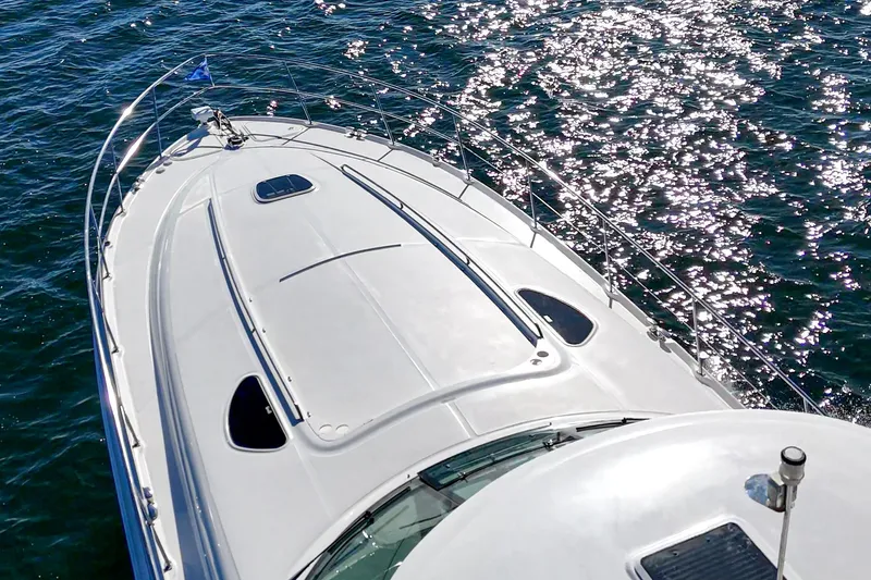 Enough 4 Now! Yacht Photos Pics 2005 Sea Ray 500 Sundancer yacht on sparkling water.