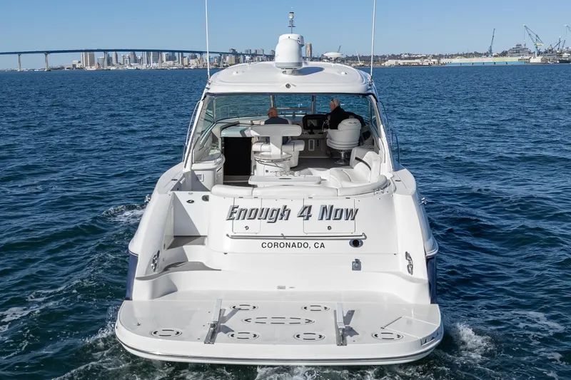 Enough 4 Now! Yacht Photos Pics 2005 Sea Ray 500 Sundancer yacht cruising near Coronado, CA with city skyline in background.