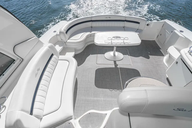 Enough 4 Now! Yacht Photos Pics 2005 Sea Ray 500 Sundancer yacht interior with elegant seating and table on open water.