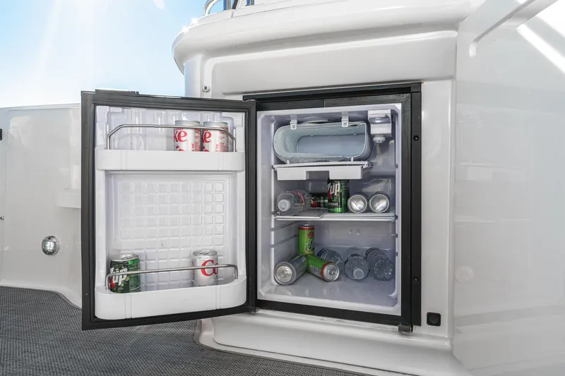Enough 4 Now! Yacht Photos Pics Open mini fridge on 2005 Sea Ray 500 Sundancer yacht, stocked with beverages.